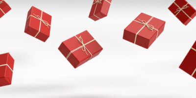 Geschenke in rotem Geschenkpapier fallen vom Himmel.