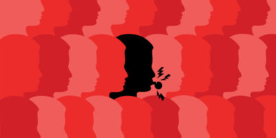 Schwarzer Kopf Person mit Trillerpfeife inmitten von roten Köpfen